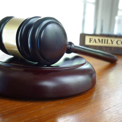 Judge's legal gavel on a desk with Family Court nameplate in the background